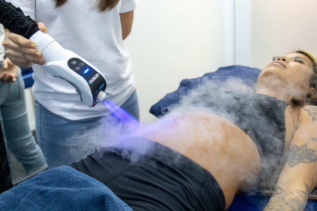 A Woman Going Under Cryotherapy | Orchard Health Clinic